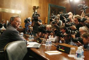 Executive Chairman of Google Eric Schmidt faces a wall of news photographers before a Senate Judiciary Subcommittee in Washington