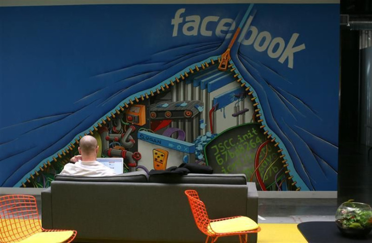 An employee works on a computer at the new headquarters of Facebook in Menlo Park