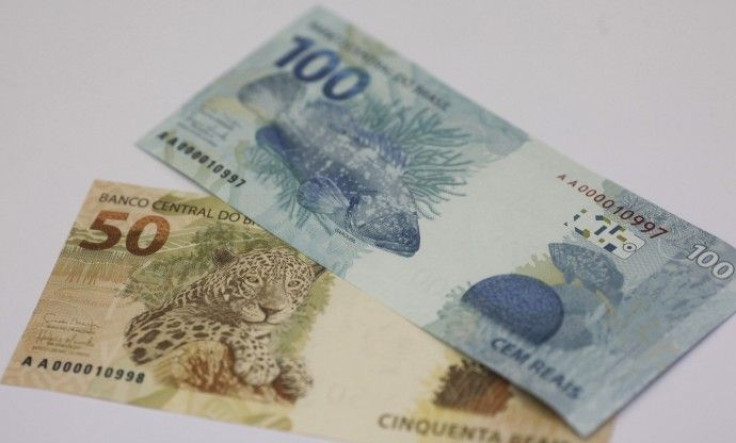 A photo illustration of new Brazilian R$50 and R$100 real currency notes after their launch in Brasilia