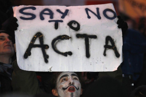 Demonstrators protest against Poland's government plans to sign Acta