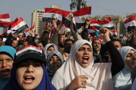 Demonstrators take part in a protest marking the first anniversary of Egypt's uprising at Tahrir Square in Cairo