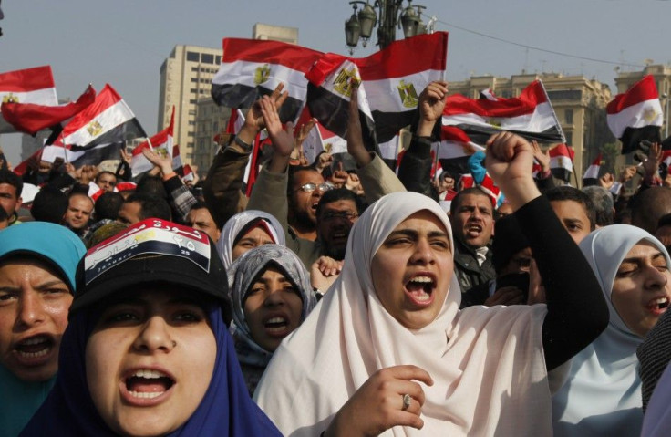 Demonstrators take part in a protest marking the first anniversary of Egypt's uprising at Tahrir Square in Cairo