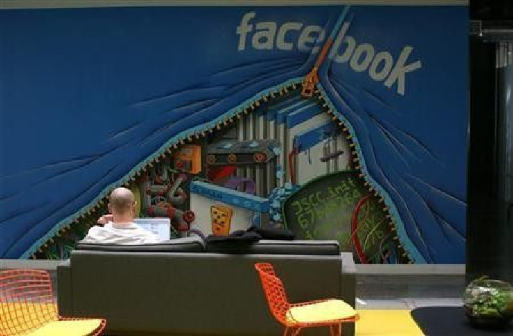 An employee works on a computer at the new headquarters of Facebook in Menlo Park, California January 11, 2012.