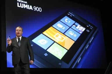 Nokia CEO Stephen Elop displays the Nokia Lumia 900 smartphone at the Consumer Electronics Show opening in Las Vegas