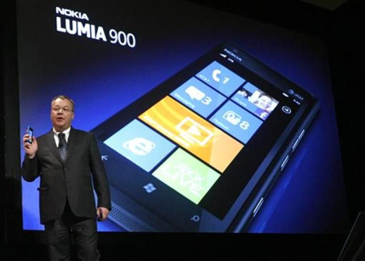 Nokia CEO Stephen Elop displays the Nokia Lumia 900 smartphone at the Consumer Electronics Show opening in Las Vegas