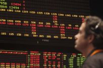 A trader looks at an order board in the S&P 500 pit at the CBOT in Chcago