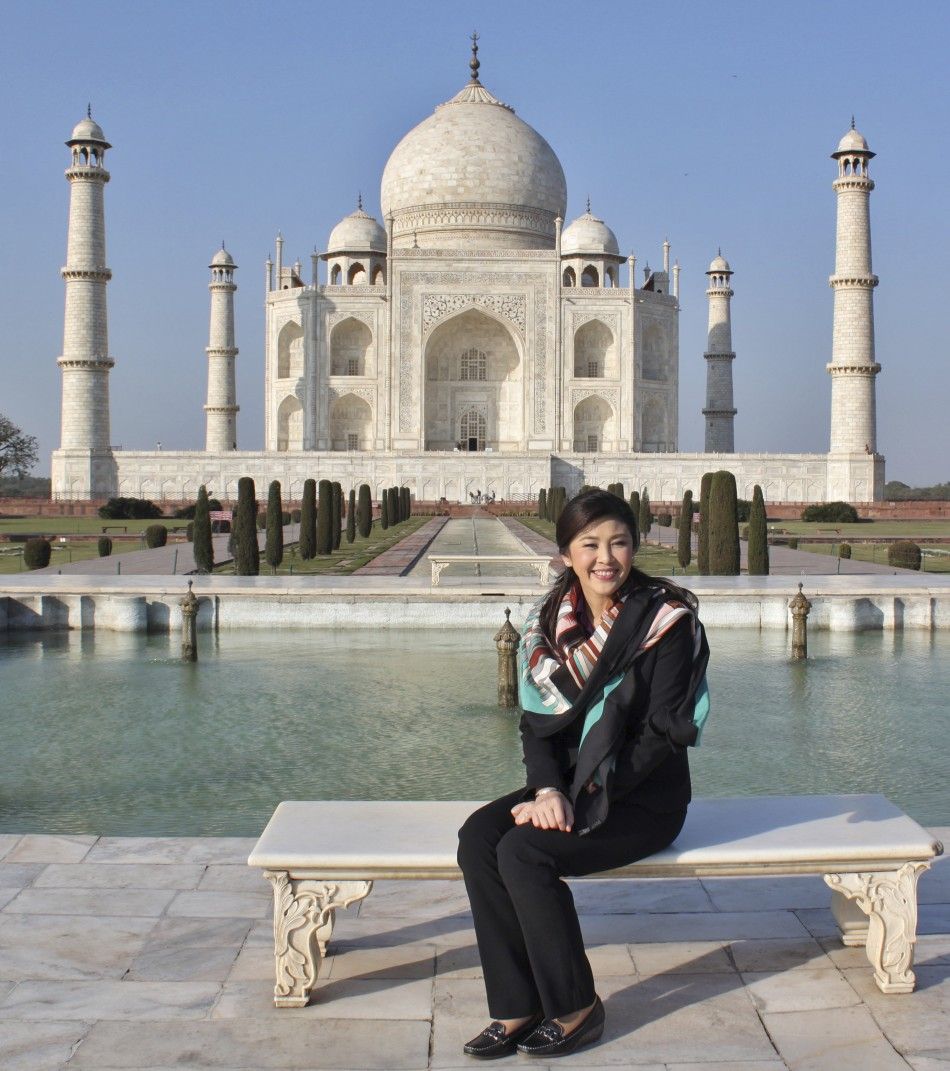 Thailand039s PM Shinawatra poses in front of the historic Taj Mahal in Agra