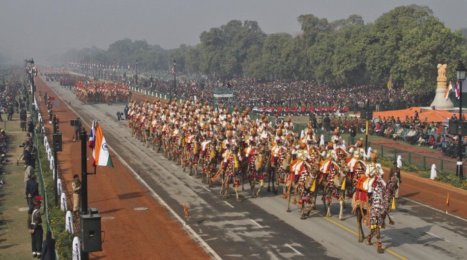 Indian BSF soldiers ride their camels during the full dress rehearsal for the Republic Day parade in New Delhi