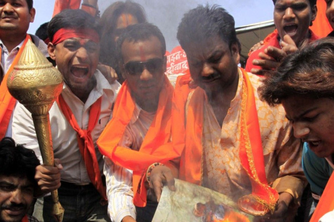 Activists of Bajrang Dal burn greeting cards shout slogans during protest against Valentine&#039;s Day celebrations in Bhopal