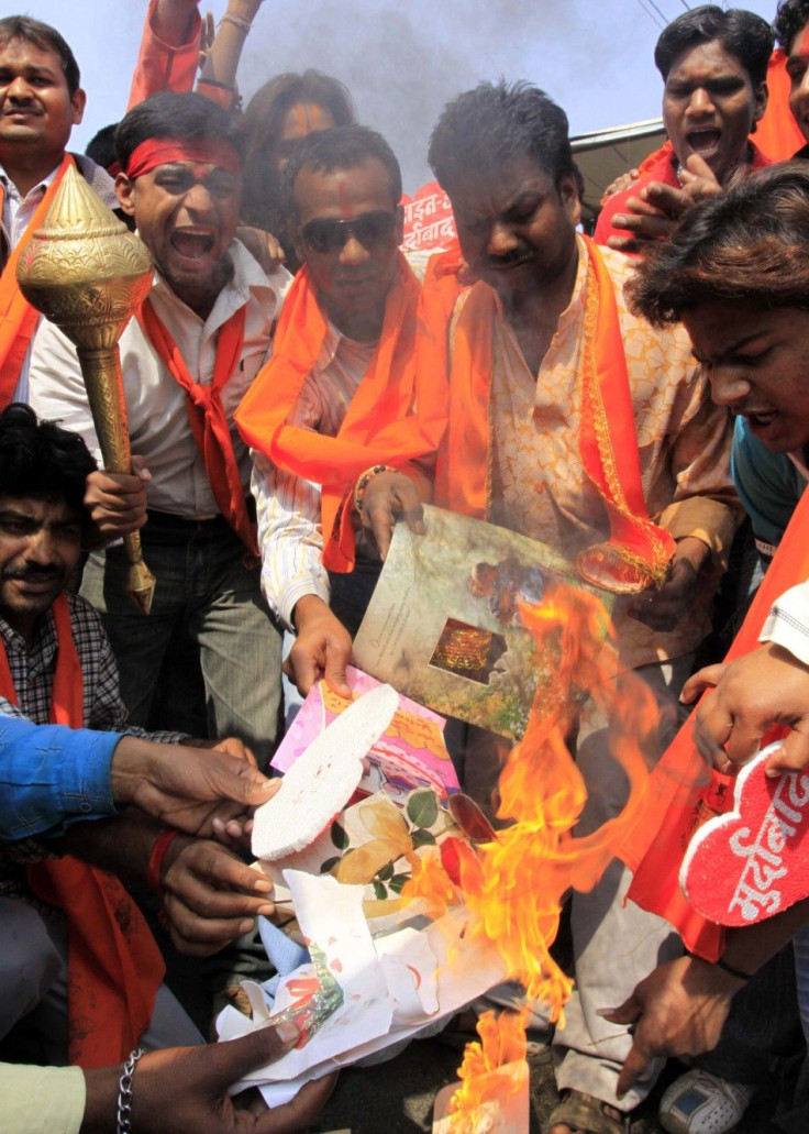 Activists of Bajrang Dal burn greeting cards shout slogans during protest against Valentine&#039;s Day celebrations in Bhopal