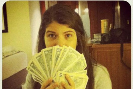 Hugo Chavez's daughter posts a photo of herself flaunting U.S. dollars in Venezuela