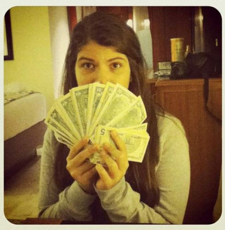 Hugo Chavez's daughter posts a photo of herself flaunting U.S. dollars in Venezuela