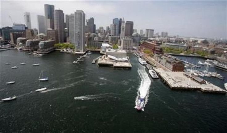 The skyline of Boston, Massachusetts is seen from over Boston Harbor