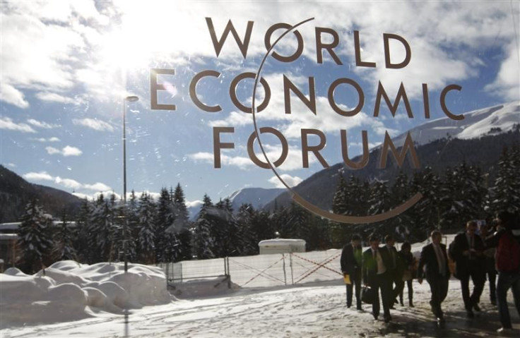 Visitors are reflected in window of the congress center, venue of the World Economic Forum (WEF) in Davos