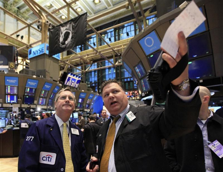 Traders work on the floor of the New York Stock Exchange January 27, 2012.