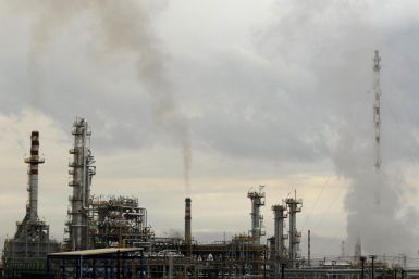 Smoke rises from the chimneys of an oil refinery near Corinth town, some 80km (50 miles) west of Athens January 24, 2012.