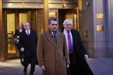 Former McKinsey chief and ex-Goldman Sachs director Rajat Gupta (C) exits the Manhattan Federal Court with his lawyers after attending a pre-trial hearing on insider-trading charges in New York January 5, 2012.