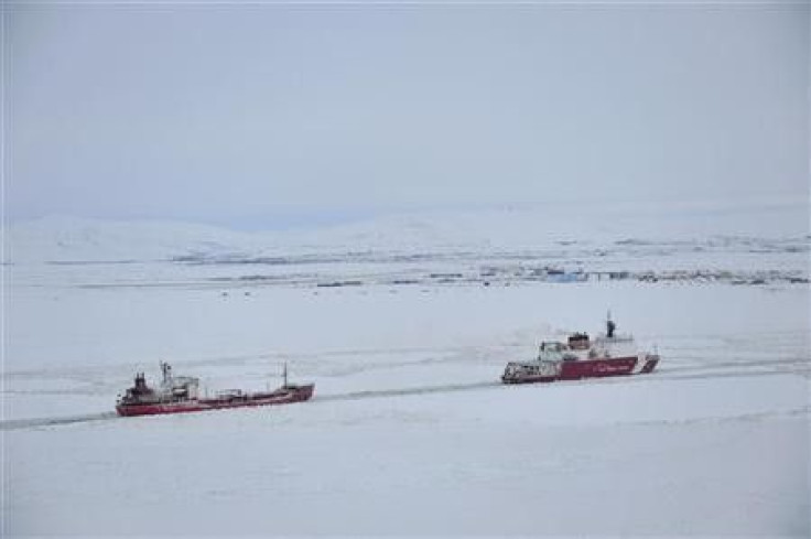 The U.S. Coast Guard cutter Healy guides the Russian tanker Renda closer to the fuel transfer mooring point off the coast of Nome, Alaska, January 14, 2012.
