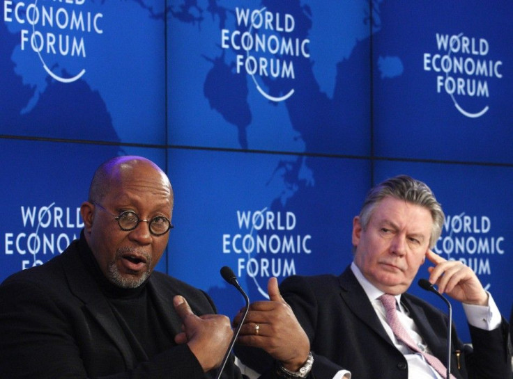 EU Trade Commission Karel De Gucht (R) and U.S. Trade Representative Ron Kirk attend a session at the World Economic Forum (WEF) in Davos, January 28, 2012.