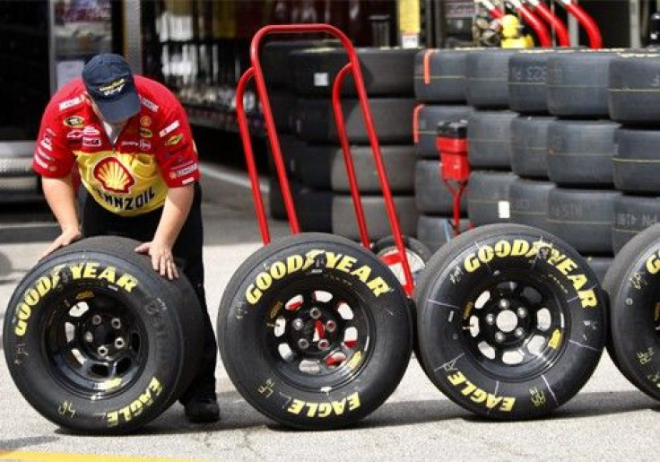 A crew member of Kevin Harvck's number 29 Chevrolet lines up Goodyear tires during the final practice session for the Daytona 500 NASCAR Sprint Cup Series race at the Daytona International Speedway in Daytona Beach, Florida February 14, 2009