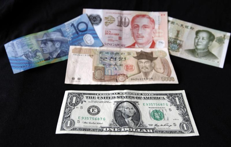 A US dollar note is pictured alongside other currencies in this picture illustration taken in Washington