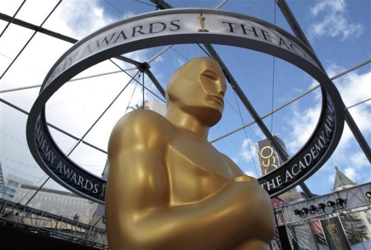 An Oscar statue is seen beneath plastic sheeting during preparations for the 83rd Academy Awards in Hollywood