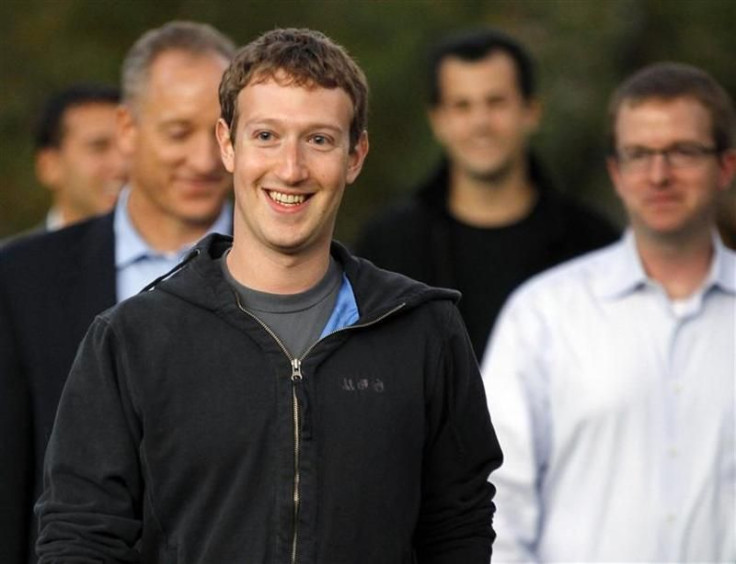 Mark Zuckerberg walks out to speak to reporters at Harvard University in Cambridge