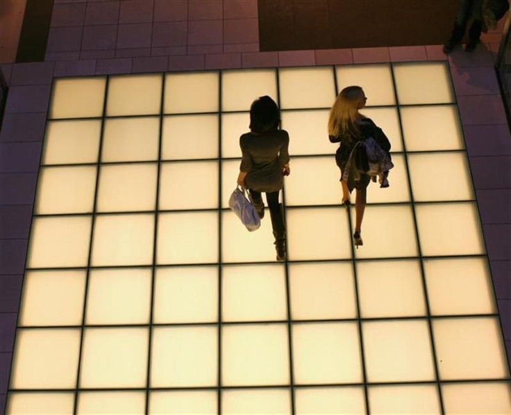 Women walk through a shopping mall 