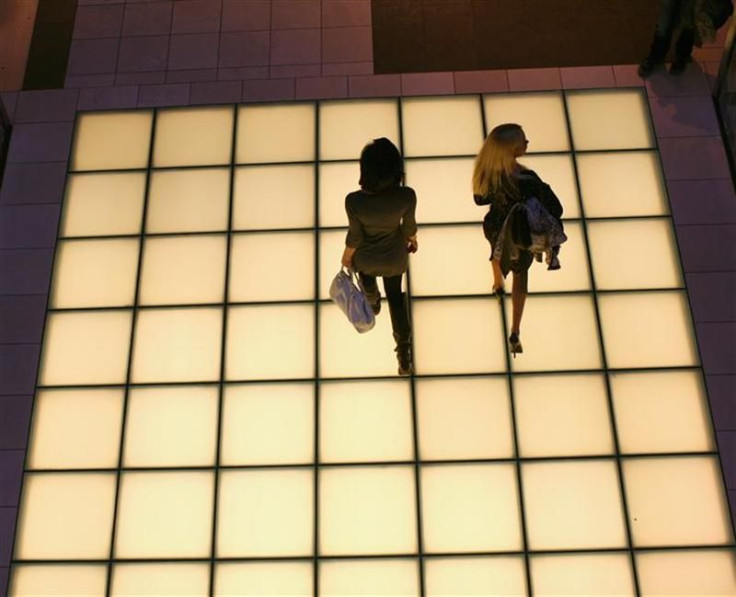 Women walk through a shopping mall