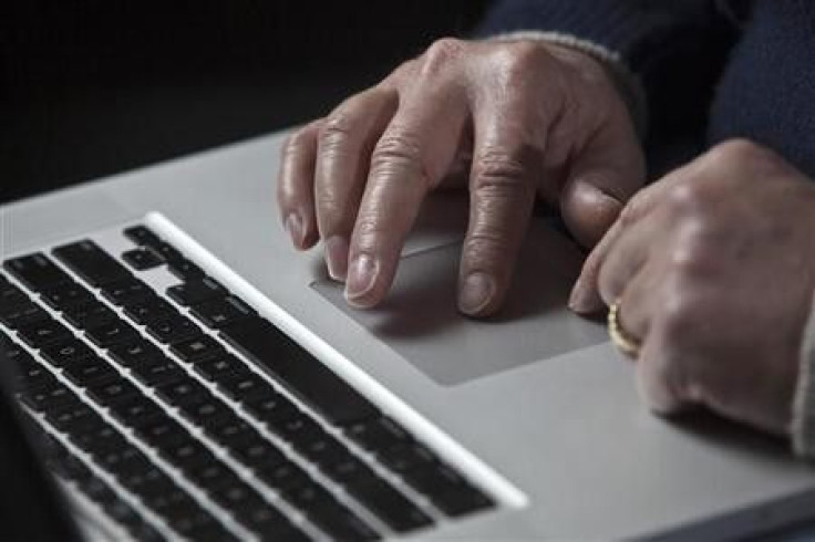 John Bumgarner, a cyber warfare expert who is chief technology officer of the U.S. Cyber Consequences Unit, a non-profit group that studies the impact of cyber threats, works on his laptop computer during a portrait session in Charlotte, North Carolina De