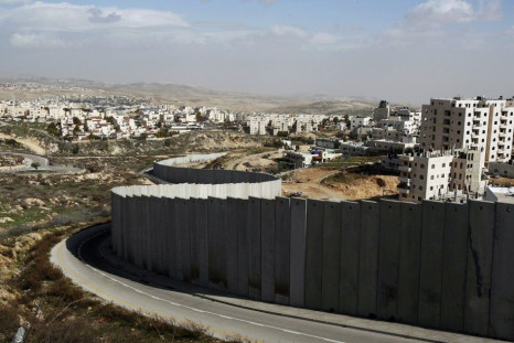 Section of controversial Israeli barrier is seen between Shuafat refugee camp, in West Bank near Jerusalem, and Pisgat Zeev, in area Israel annexed to Jerusalem after capturing it in 1967 Middle East war
