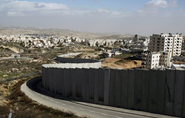 Section of controversial Israeli barrier is seen between Shuafat refugee camp, in West Bank near Jerusalem, and Pisgat Zeev, in area Israel annexed to Jerusalem after capturing it in 1967 Middle East war