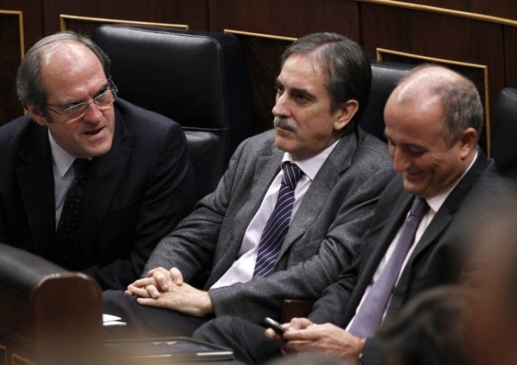 Spain's Education Minister Gabilondo talks to Labour Minister Gomez and Industry Minister Sebastian at Spanish parliament in Madrid