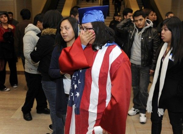 Students, some wearing graduation caps and gowns, cry after watching from the senate gallery as opponents block passage of the &quot;Dream Act&quot; at the U.S. Capitol in Washington, December 18, 2010. 