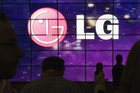 Showgoers walk past a display at the LG Electronics booth during the 2012 International Consumer Electronics Show (CES) in Las Vegas