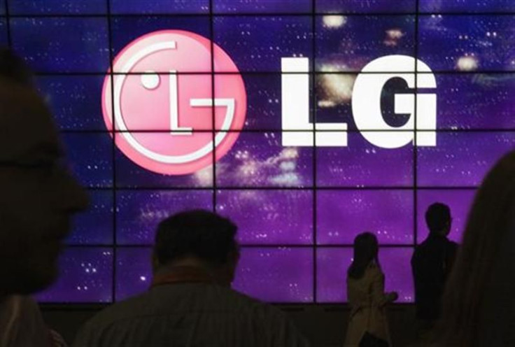 Showgoers walk past a display at the LG Electronics booth during the 2012 International Consumer Electronics Show (CES) in Las Vegas