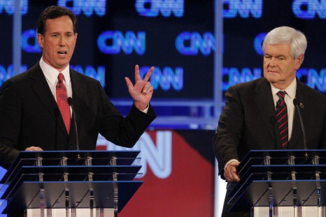 Republican presidential candidate Santorum speaks as Gingrich listens during the Republican presidential candidates debate in Jacksonville