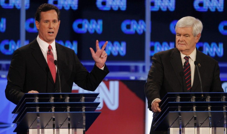 Republican presidential candidate Santorum speaks as Gingrich listens during the Republican presidential candidates debate in Jacksonville