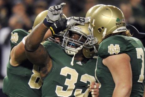 Notre Dame football players celebrate a touchdown against Army
