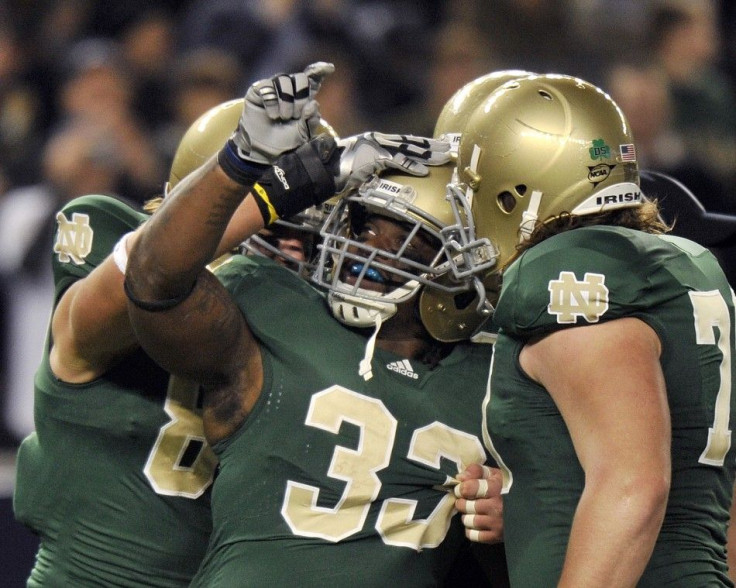 Notre Dame football players celebrate a touchdown against Army