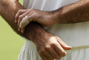  A bandage protects a little finger of Australia's captain Ricky Ponting as he stands on the field after they defeated England in the third Ashes cricket test at the WACA ground in Perth.