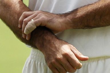  A bandage protects a little finger of Australia's captain Ricky Ponting as he stands on the field after they defeated England in the third Ashes cricket test at the WACA ground in Perth.