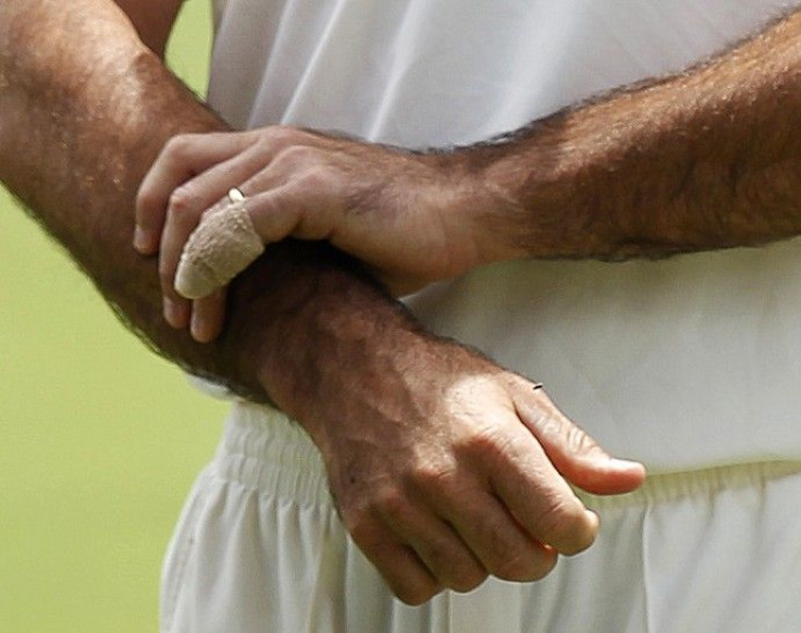  A bandage protects a little finger of Australia's captain Ricky Ponting as he stands on the field after they defeated England in the third Ashes cricket test at the WACA ground in Perth.