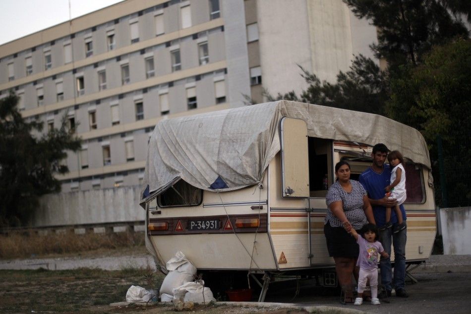 The Silva family in front of their trailer home, before being evicted