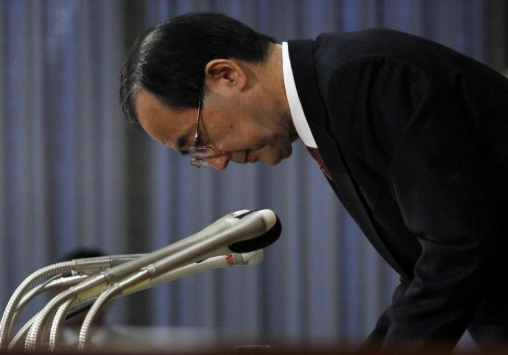 Bank of Japan Governor Shirakawa bows to greet reporters after a news conference at the BOJ headquarters in Tokyo