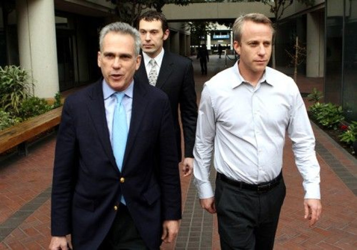 James Fleishman (R) walks out of the Robert Peckman United States Courthouse with his attorney Stuart Gasner (L) after appearing in federal court on insider trading charges in San Jose, California December 16, 2010