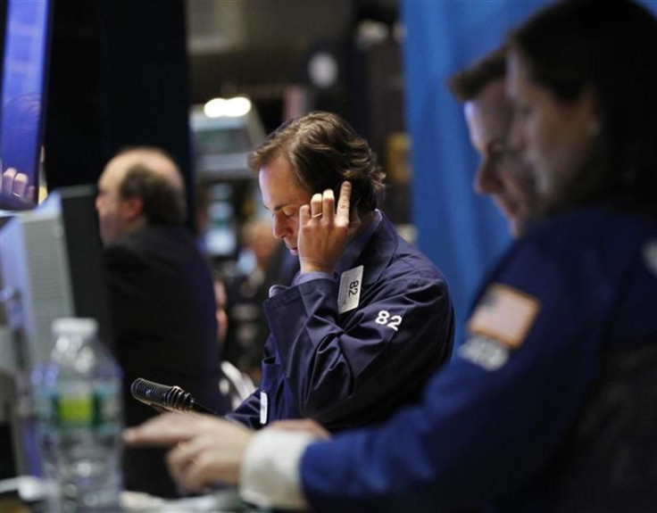 Trader Dudley Devine works on the floor of the New York Stock Exchange