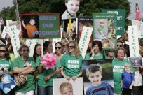Families from across the U.S. living with autism take part in a rally calling to eliminate toxins from children's vaccines in Washington June 4, 2008.