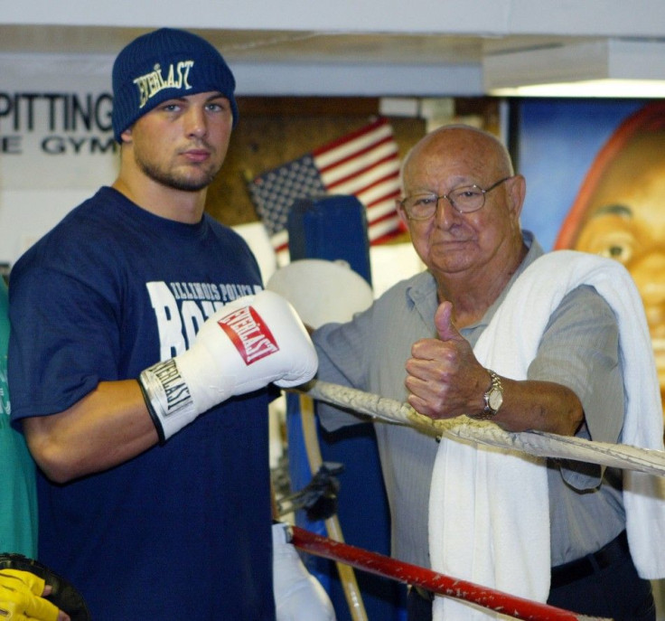 Zbikowski and his trainer Dundee pose for a photo at his training camp in New York