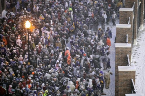 Fans wait for gates to open before start of the Vikings' outdoor NFC, NFL football game against the Bears in Minneapolis